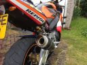 Honda_CBR900_954_Fireblade_A16_Moto_GP_Carbon_Exhaust_with_Titanium_Outlet_-_Repsol_Rear_Bike.JPG